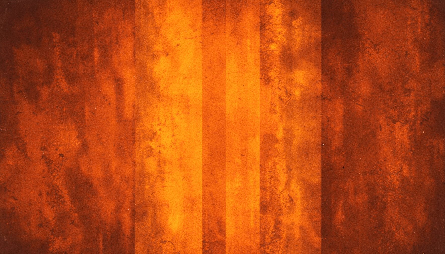Warm amber and rust-toned abstract texture suggesting vintage vinyl and analog warmth.